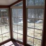 Inside view of 4 track vertical sliding vinyl windows with aluminum framing