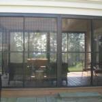 Combination screen and vinyl horizontal sliders, with bronze aluminum framing